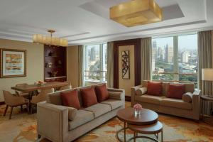 a living room with a couch and a table at Radisson Blu Hotel Shanghai New World in Shanghai