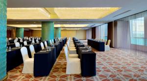 a row of tables and chairs in a conference room at Radisson Blu Hotel Shanghai New World in Shanghai