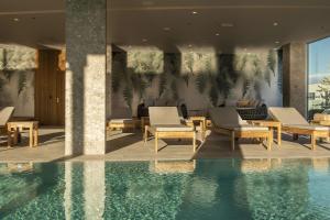 a resort with a swimming pool and lounge chairs at Radisson Blu Resort & Spa in Split