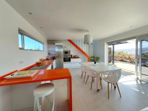 A kitchen or kitchenette at Private villa with pool in Lajares
