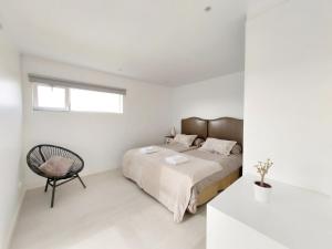 A bed or beds in a room at Private villa with pool in Lajares