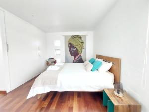 A bed or beds in a room at Private villa with pool in Lajares