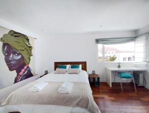A bed or beds in a room at Private villa with pool in Lajares