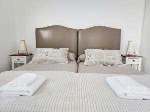 A bed or beds in a room at Private villa with pool in Lajares