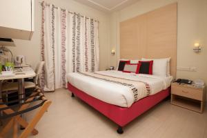 Letto o letti in una camera di Avalon Courtyard Residence Suites