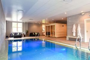 a large swimming pool in a living room at Scandic Star Lund in Lund