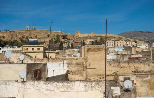 a view of a city with buildings on a hill at Riad Rajy in Fez
