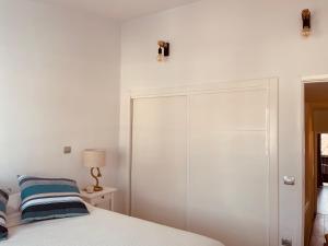Ein Bett oder Betten in einem Zimmer der Unterkunft VIVIENDA ÚNICA EN PRIMERA LÍNEA DE PLAYA