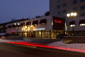 a building with a start sign on the side of it at Scandic Kungens Kurva in Stockholm