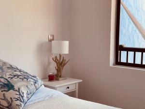 Ein Bett oder Betten in einem Zimmer der Unterkunft VIVIENDA ÚNICA EN PRIMERA LÍNEA DE PLAYA