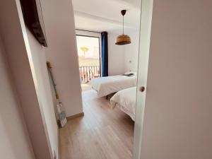 Ein Bett oder Betten in einem Zimmer der Unterkunft VIVIENDA ÚNICA EN PRIMERA LÍNEA DE PLAYA