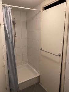 a bathroom with a shower and a bath tub at SASS APARTHOTEL in Schönenwerd