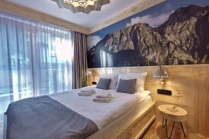 מיטה או מיטות בחדר ב-Tatra Square Apartments