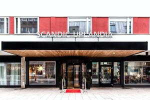 a store front of a building with a sign on it at Scandic Uplandia in Uppsala