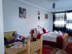 Postel nebo postele na pokoji v ubytování RIAD Camping ATLAS
