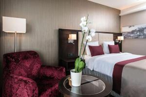 Posteľ alebo postele v izbe v ubytovaní Wyndham Grand Salzburg Conference Centre
