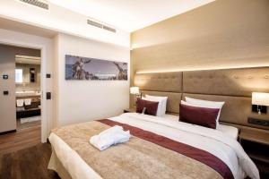Posteľ alebo postele v izbe v ubytovaní Wyndham Grand Salzburg Conference Centre