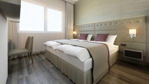 Posteľ alebo postele v izbe v ubytovaní Wyndham Grand Salzburg Conference Centre
