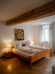 En eller flere senger på et rom på Regensburger Ferienwohnungen - Im Herzen der Altstadt