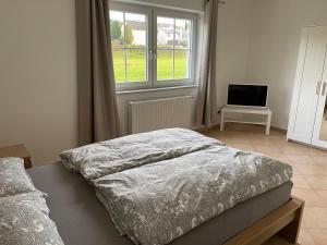 Postel nebo postele na pokoji v ubytování Apartment Mühlbach