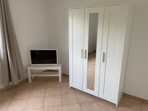 TV a/nebo společenská místnost v ubytování Apartment Mühlbach
