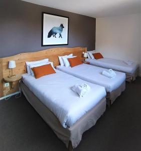 Voodi või voodid majutusasutuse Hôtel Aalborg toas