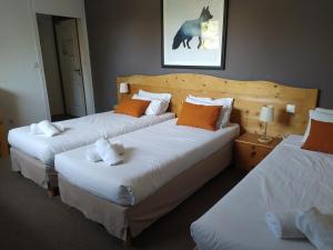 Voodi või voodid majutusasutuse Hôtel Aalborg toas