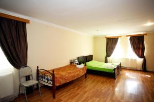 Postel nebo postele na pokoji v ubytování Guest House Iaraji