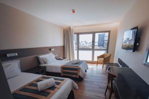 TV a/nebo společenská místnost v ubytování SEC Hotel