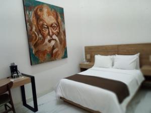 Postel nebo postele na pokoji v ubytování Vía Real Hotel Boutique + 17 fotografií