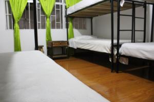 Postel nebo postele na pokoji v ubytování Hostal Cafe San Bernabe