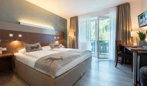 Postel nebo postele na pokoji v ubytování Hotel Residenz Hochalm - Joker Card Partner