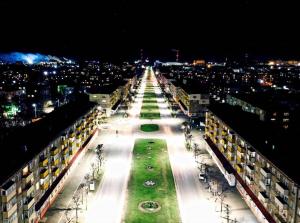 a view of a lit up city at night at Chap34 in Borisov in Borisov