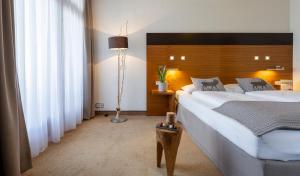 Postel nebo postele na pokoji v ubytování Hotel Residenz Hochalm - Joker Card Partner