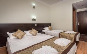 Postel nebo postele na pokoji v ubytování Zel Hotel