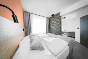 Postel nebo postele na pokoji v ubytování Hotel Diana