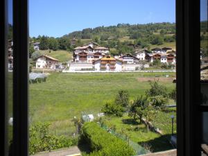 a view from a window of a village at B&B fam. Ausermiller in Castello di Fiemme