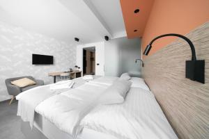 Postel nebo postele na pokoji v ubytování Hotel Diana