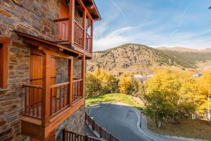 a view from a balcony of a house with a road at Soldeu nature - Parking Gratis - Disfruta En Familia in Canillo