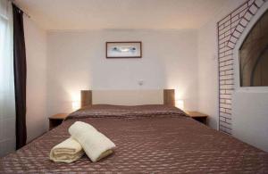 Posteľ alebo postele v izbe v ubytovaní Apartment in Rovinj - Istrien 11608