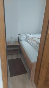 Cama ou camas em um quarto em Petar - Jahorinski IZLOG