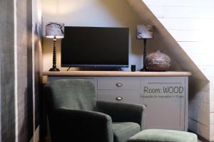 TV a/nebo společenská místnost v ubytování Oustalet Spa