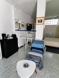 a room with two beds and a table at Suite à sidi bou Saïd in Sidi Bou Saïd