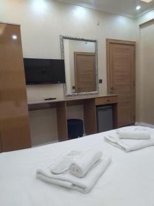 A bed or beds in a room at BoNaMi Hotel Még 37 kép