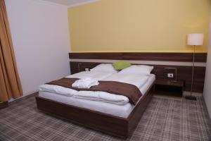 Posteľ alebo postele v izbe v ubytovaní Primus Hotel & Apartments