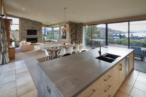 a kitchen and living room with a view of a living room at Takapō Retreat - Lake Tekapo in Lake Tekapo