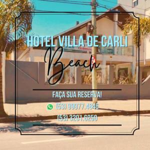 a sign for a hotel villa bella cavani beach at Hotel Villa De Carli Beach in Rio Grande