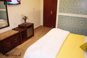 Ένα ή περισσότερα κρεβάτια σε δωμάτιο στο The location Hotel