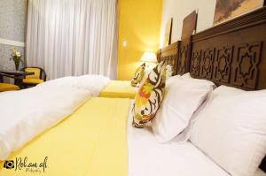 Ένα ή περισσότερα κρεβάτια σε δωμάτιο στο The location Hotel