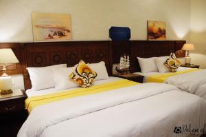 Ένα ή περισσότερα κρεβάτια σε δωμάτιο στο The location Hotel
